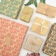 HAPPY BIRTHDAY WRAPPING PAPER feature classy "Happy Birthday" lettering design with plain brown kraft paper on the reverse available in 7 different trendy colors HAPPY BIRTHDAY WRAPPING PAPER feature classy "Happy Birthday" lettering design with plain brown kraft paper on the reverse available in 7 different trendy colors